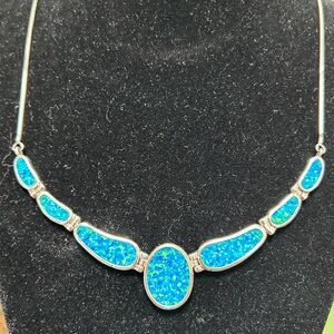 Beautiful lab grown blue opal and sterling silver vintage necklace.